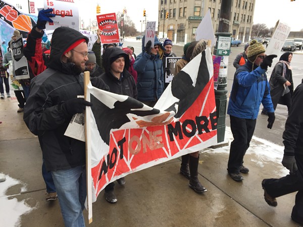 Demonstrators march from Roosevelt Park to the federal building in downtown Detroit to urge lawmakers to pass a "clean" Dream Act. - Violet Ikonomova