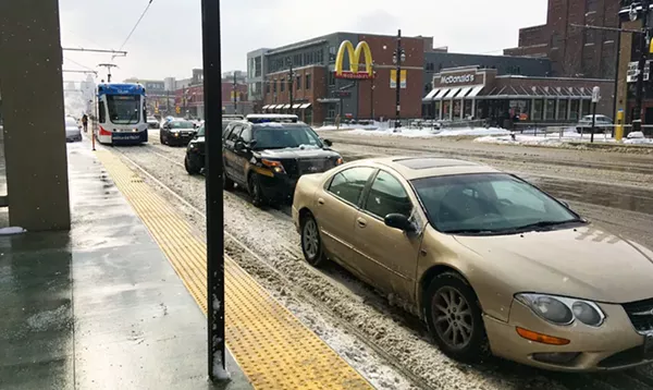 A reminder to please not park on the QLine tracks