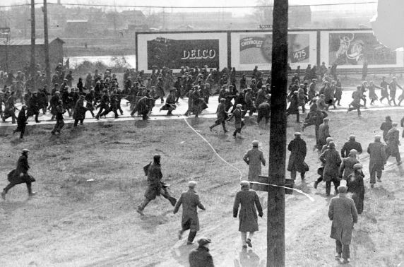 Demonstrators on Miller Road outside of the Rouge Plant flee as tear gas and bullets are released on them by Dearborn Police and Ford Servicemen during the 1932 Ford Hunger March. - Photo courtesy Walter Reuther Library, Wayne State University