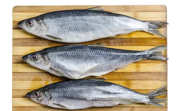 A Macomb County man was charged with striking a grocery store clerk over the head with a frozen fish.