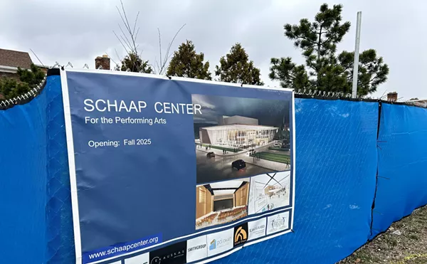 A chain-link fence and blue tarp covers the historic plot of land in Detroit.