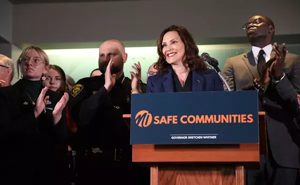 Gov. Gretchen Whitmer celebrates after signing a package of gun-control bills on Thursday.