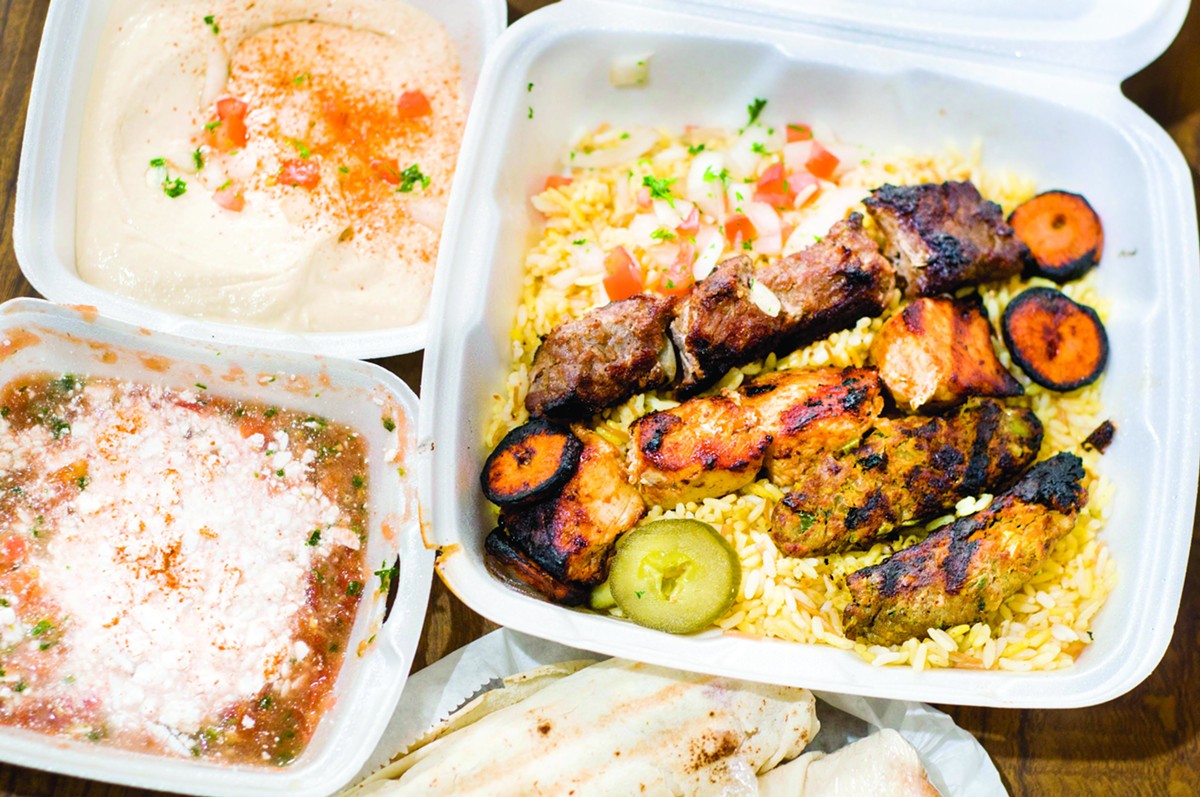 From top right, counterclockwise: Shish combo with Tahama kebab, beef shawarma and chicken tawook; hummus; sahawik with jubn; Tahama kebab sandwich.