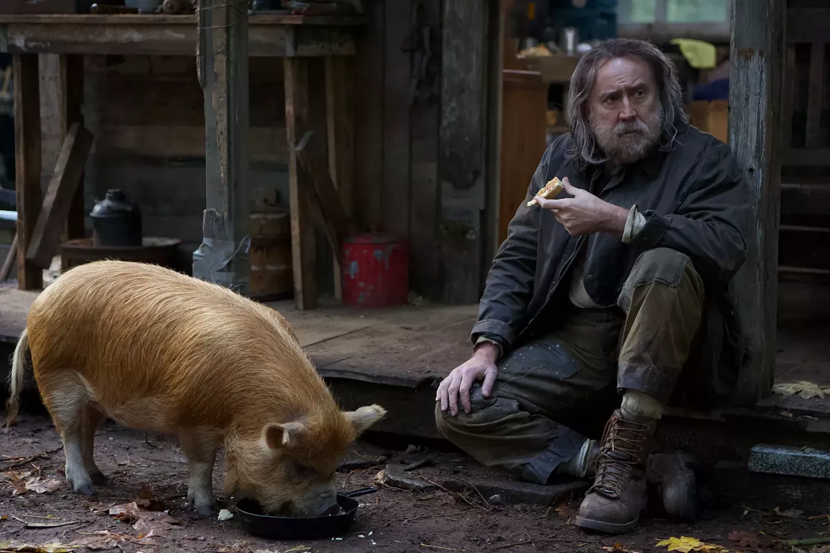 Nicolas Cage (right) and a furry friend.