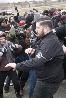 A neo-Nazi group and anti-fascist protesters clash at Michigan State University.