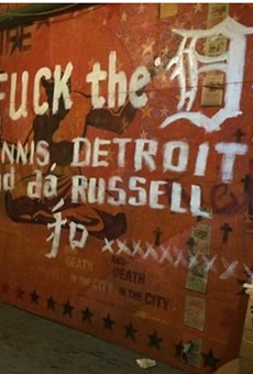 Anti-Dennis Kefallinos graffiti scrawled across a mural at the Russell Industrial Center