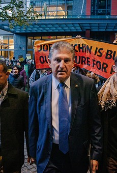 Sen. Joe Manchin confronted by climate activists on his way to Capitol Hill. 