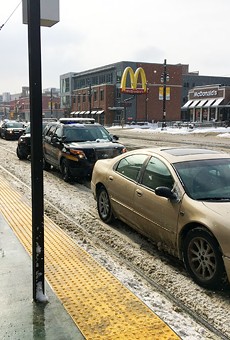 A reminder to please not park on the QLine tracks