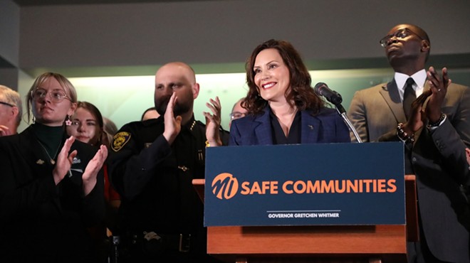 Gov. Gretchen Whitmer celebrates after signing a package of gun-control bills on Thursday.