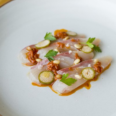 Hamachi with calabrese chili, pine nut, and caperberries.