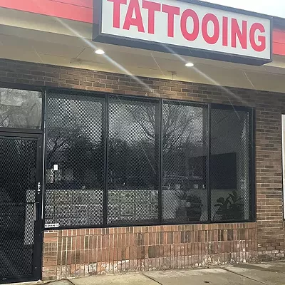A Detroit-area tattoo artist charged with sexual misconduct is tattooing under a different name — and laughing about it