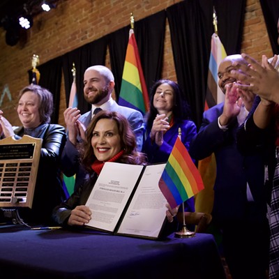 Gov. Gretchen Whitmer signs a bill expanding the state's civil rights act to protect LGBTQ people.