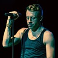 Macklemore performing in Toronto during The Heist Tour on 28 November, 2012. Photo from Wikipedia, used under creative commons; image taken by Drew of The Come Up Show.