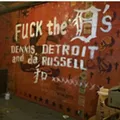 Anti-Dennis Kefallinos graffiti scrawled across a mural at the Russell Industrial Center Anti-Dennis Kefallinos graffiti scrawled across a mural at the Russell Industrial Center