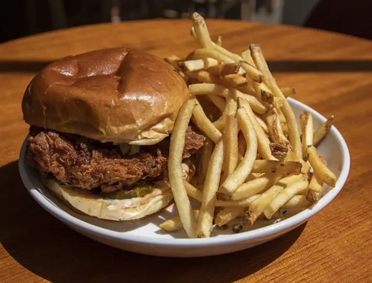 Table at Fort Street Galley &#151; Nashville Hot Chicken Sandwich
160 W. Fort St., Detroit; 313-230-0855; fortstreetgalley.org/restaurants/table
Fort Street Galley might be a gussied-up food court, but this isn&#146;t your average mall restaurant chicken sandwich. Table, run by esteemed chef Phill Milton, focuses on American comfort food with modern ingredients and a chef&#146;s touch. Their Nashville hot chicken sandwich stays true to the classic while staying a cut above the rest with a cayenne-lard paste, bleu cheese, and a heaping load of fries to go with it.
Photo via  Bridget Ekis