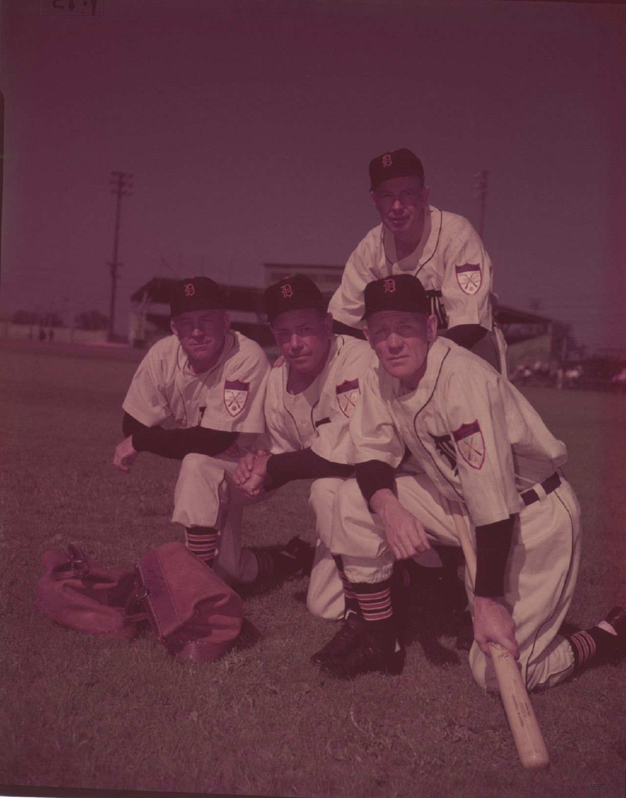 Detroit Tigers manager and coaching staff, sporting Detroit 250th patches on their uniforms in 1951.