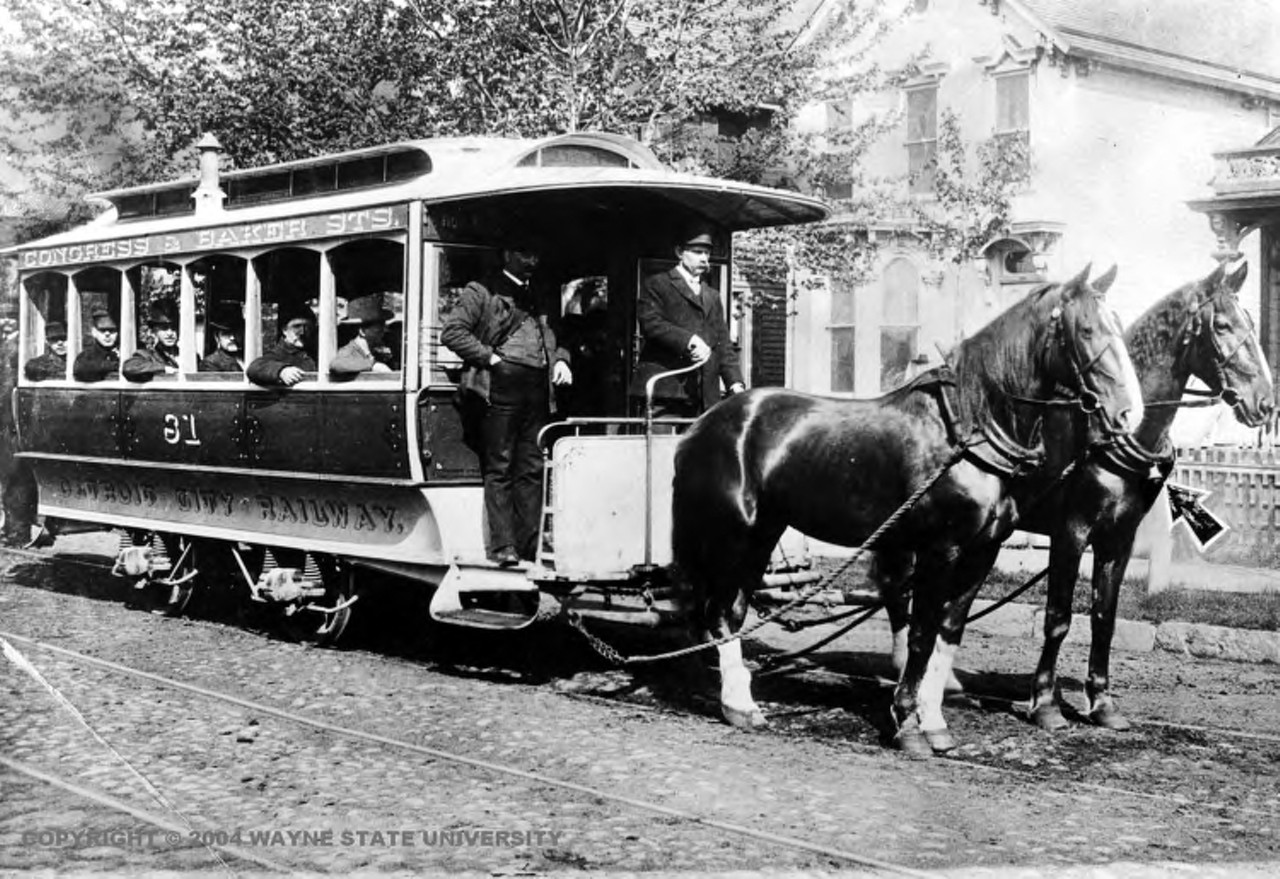 By the early 1860s, Jefferson, Woodward, Gratiot and Michigan avenues were already trimmed with rail. Catering to the city's upper classes, dray teams pulled passengers along Detroit's radial arteries at a stately pace for 5 cents. Pictured here is a horse car of the Detroit City Railway. Note the arrow pointing to the bell on one horse&#146;s neck.