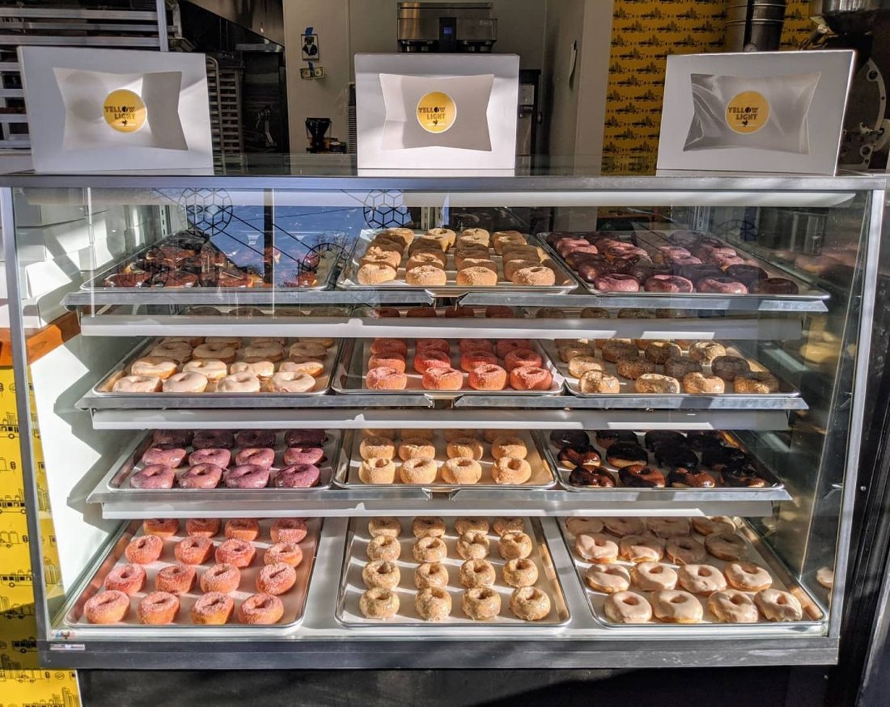 Yellow Light Coffee & Donuts 
14447 E. Jefferson Ave., Detroit;  yellowlightdetroit.com  
Yellow Light Coffee & Donuts has been in the works since October 2019 and is the latest culinary project from Jacques and Christine Driscoll, who co-own successful Detroit eateries Green Dot Stables and Johnny Noodle King. Friend, artist, and coffee roaster Niko Dimitrijevic join Yellow Light, who returned to Detroit after working in Seattle as a glassblower. In addition to in-house roasted brew, their menu offers a selection of uniquely flavored doughnuts, such as Mai Tai, blueberry maple, orange sugar, hibiscus lime, brown butter plantain, and coconut. Oh, and they have a drive-thru. 
Photo via Yellow Light Coffee & Donuts/Facebook