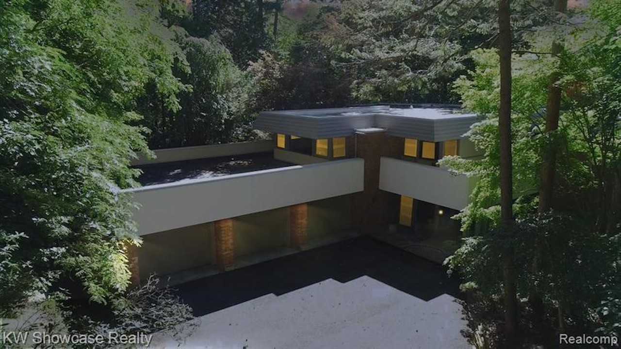 This Frank Lloyd Wright-inspired waterfront home in Michigan has an artist loft, atrium, and waterfall