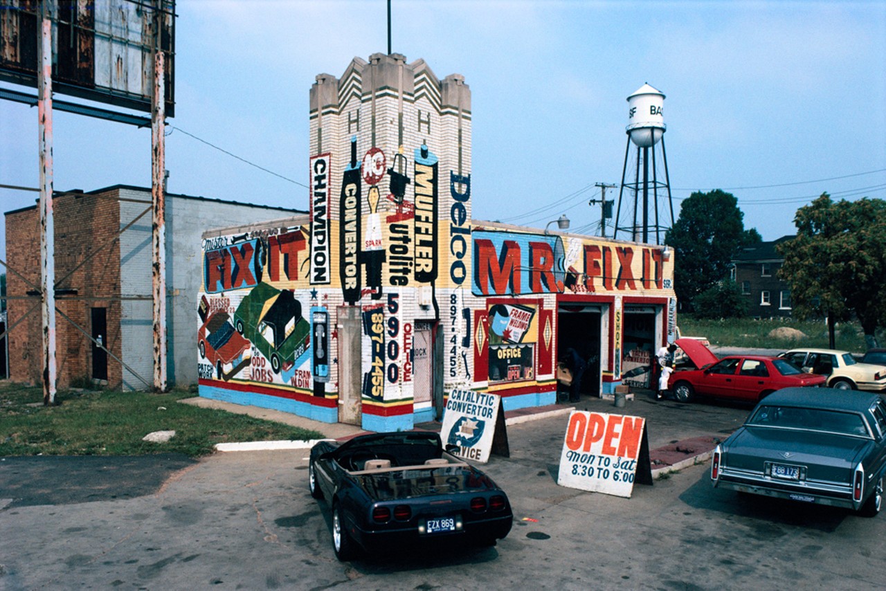 Mr. Fix It, a former 1920s High Speed Gas Station in 1995. The artwork is by Eugene an itinerant sign painter with a distinctive style. His fading store signs can still be seen in southwest Detroit. Epworth St. at West Warren, Detroit, 1995