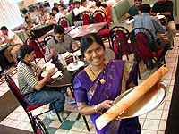 Udipi: Thilagam Pandian serves dosa (Indian crepe) - Metro Times Photo / Larry Kaplan