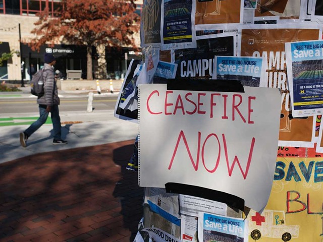 “Ceasefire Now” handwritten sign on a kiosk in downtown Ann Arbor.