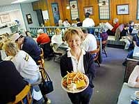 Whistle Stop Restaurant: Waitress Elizabeth Kearns serves a cheeseburger and fries - Metro Times Photo / Larry Kaplan