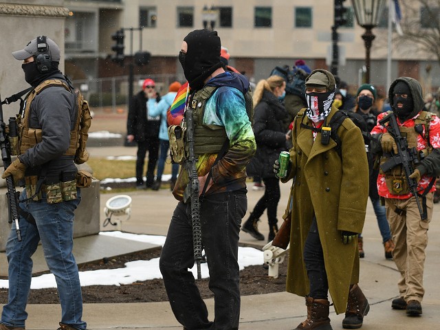 Armed protestors in Lansing support Donald Trump's baseless claims of election fraud.