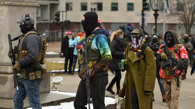 Armed protestors in Lansing support Donald Trump's baseless claims of election fraud.