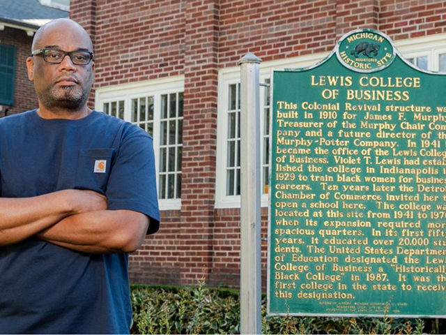 Dr. D’Wayne Edwards in front of the historic Lewis College of Business.