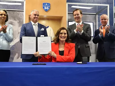 Image: Whitmer signs legislation to curb distracted driving in Michigan