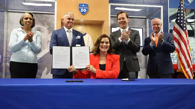 Image: Whitmer signs legislation to curb distracted driving in Michigan