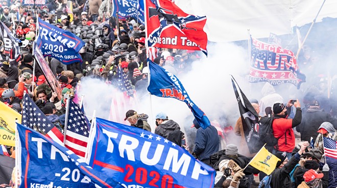 Smoke rises after police used pepper spray against Pro-Trump supporters on Jan. 6, 2021.