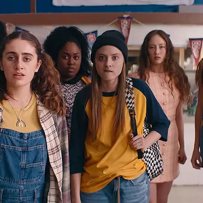 In Bottoms, queer girls Josie (Ayo Edebiri) and PJ (Rachel Sennott), on the far left, cope with the absurdity of high school.