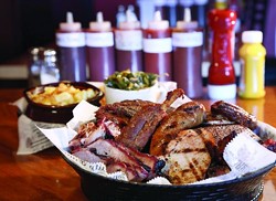 Z’s BBQ Sampler (with St. Louis pork ribs, Carolina pulled pork, Texas beef brisket, house-smoked sausage, house turkey breast, Detroit-style burnt ends, and hog wings) from Little Z’s BBQ in St. Clair Shores.